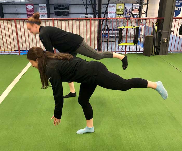 two woman doing balance test