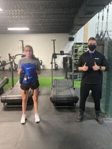 Girl getting bag from trainer