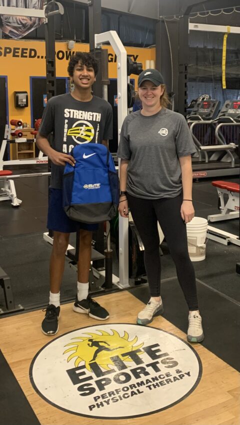 Boy standing with his trainer