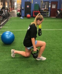 Girl doing weighted lunges