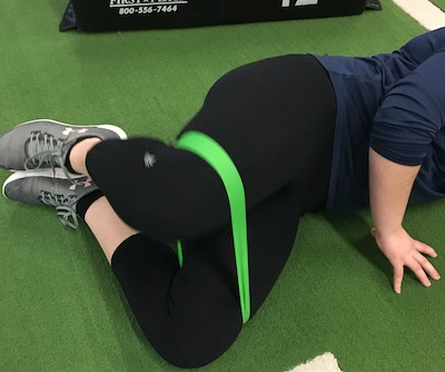 woman working out with stretch band