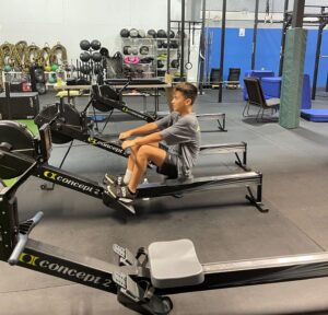 boy doing rowing