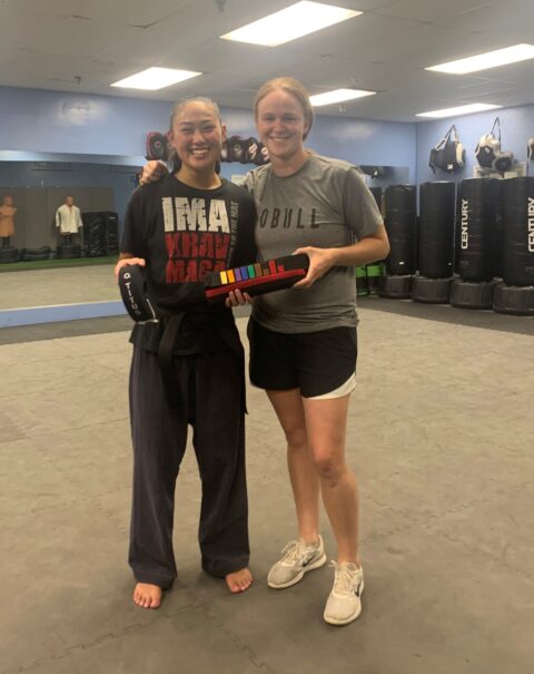 girl receiving gift from trainer