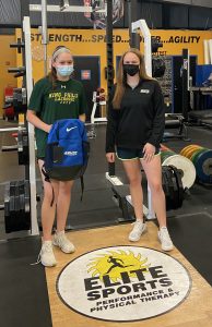 girl receiving bag from her trainer