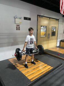 boy doing deadlift