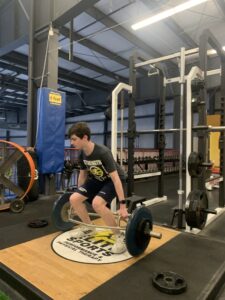 Boy doing deadlift