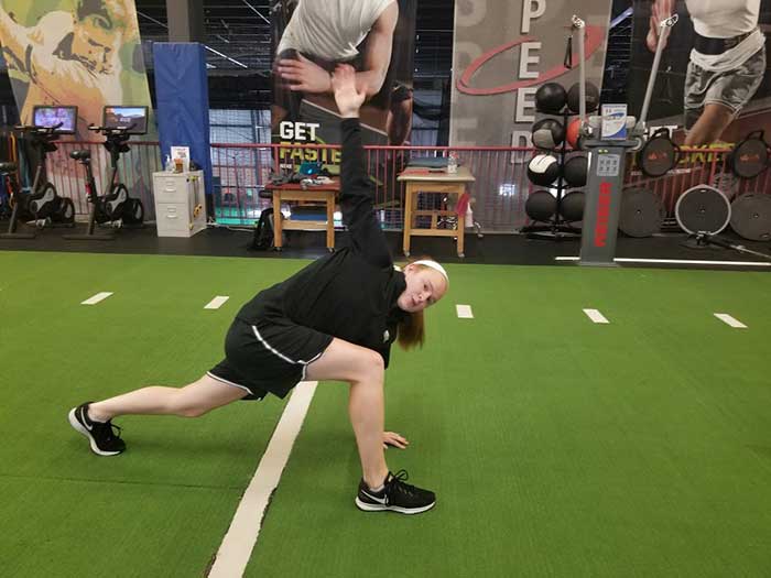 woman doing spiderman lunge